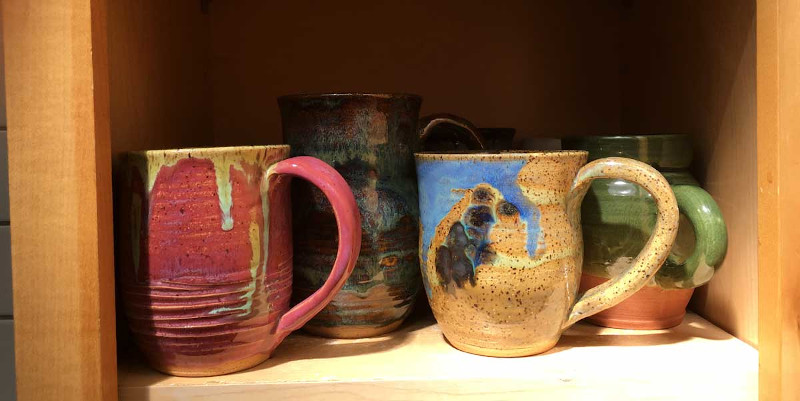 Photo of Eric's collection of handmade pottery mugs