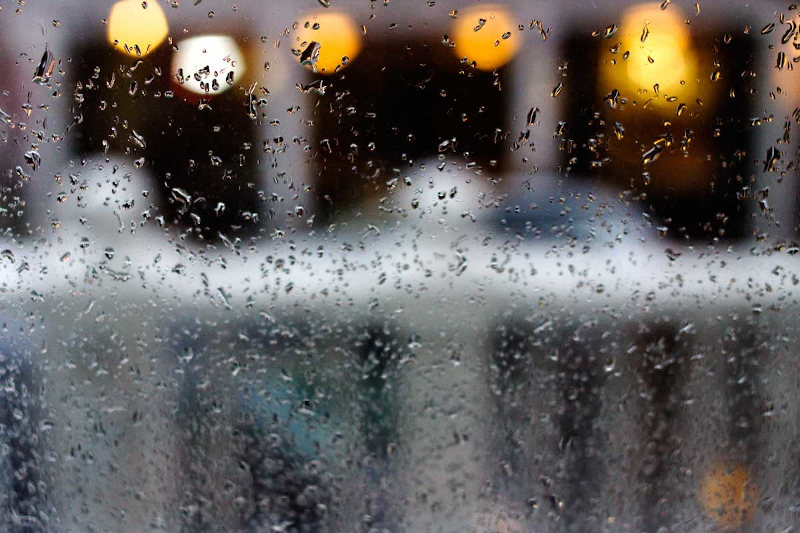 Photo of a rain-drop spattered window